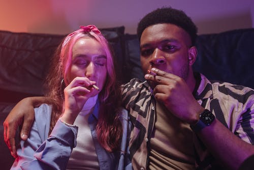 couple smoking marijuana